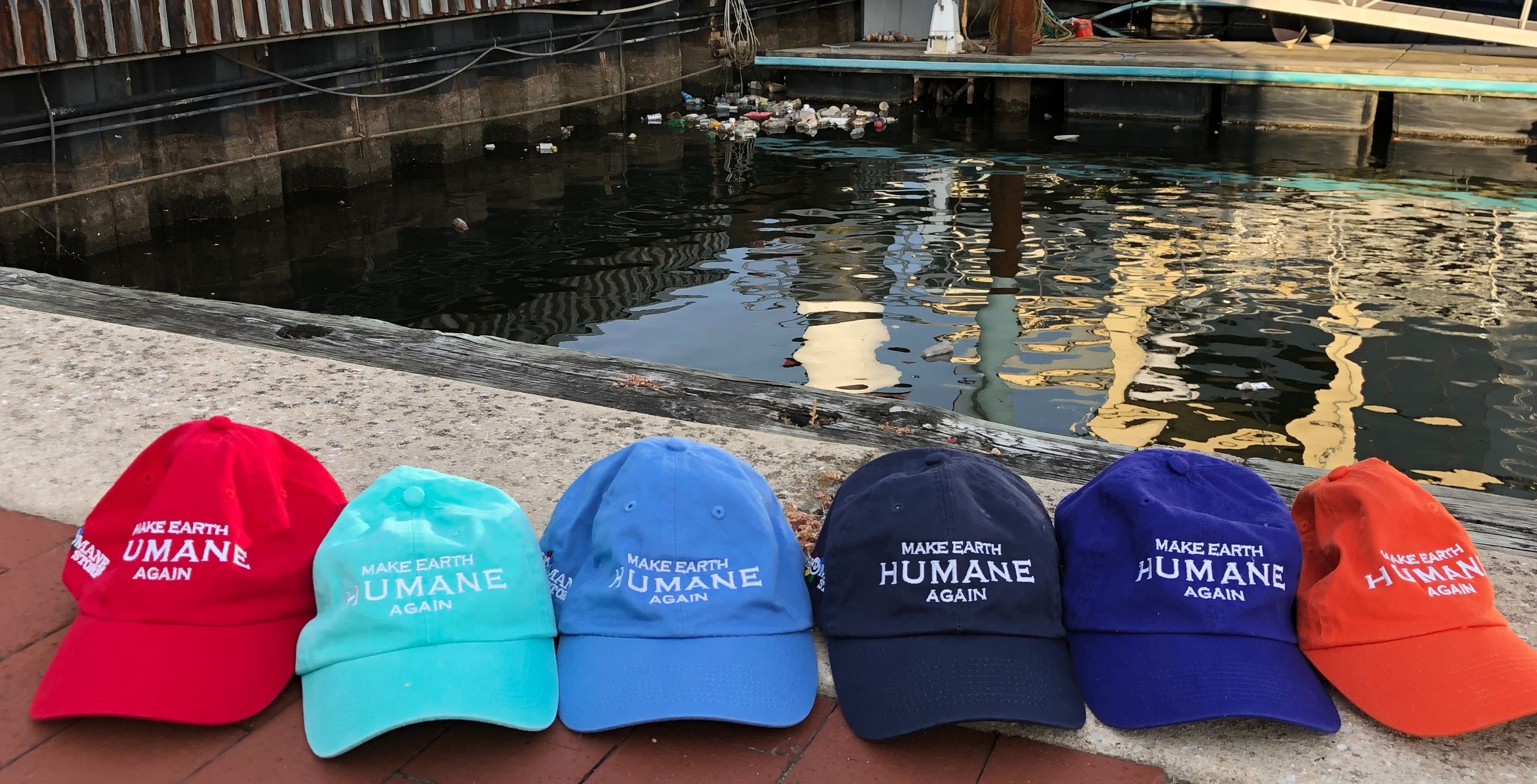 Make Earth Humane Again Caps